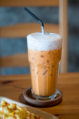 Thai milk tea in glass on the table.