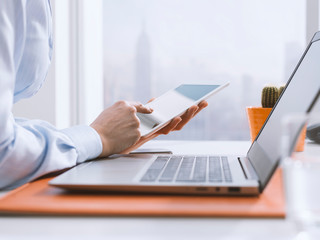 Corporate businesswoman using a digital tablet