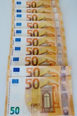fifty euro banknotes on a white background close-up