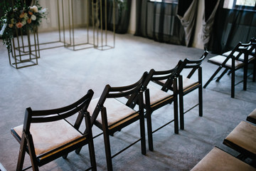 Wedding arch and indoor wedding ceremony. Decoration of the wedding ceremony