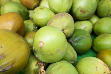coconut fruit stacked on the marketplace