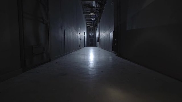 camera walking in the path inside prison with cells