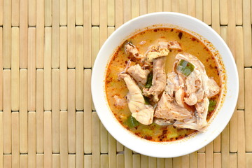 spicy boiled bass fish in tom yum soup on bowl
