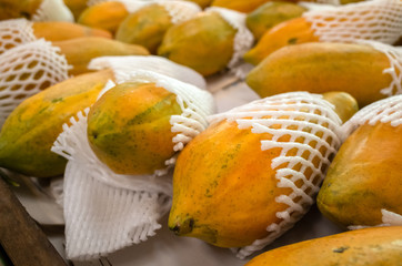 papaya fruit stacked on the marketplace