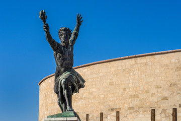Fototapeta na wymiar Hungary, Budapest, Gellert Hill: Flame of Freedom Statue next to famous Liberty Statue above the city center of the Hungarian capital with blue sky in the background - travel liberation history war