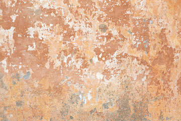 Old beige chipped wall texture background in Italy
