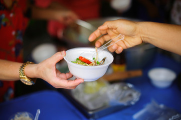 People who are rich and mentally assisting people in society, sharing food for the hungry : Help and Donation Concepts
