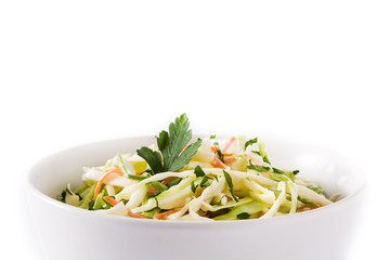 Coleslaw salad in white bowl isolated on white background. Copyspace