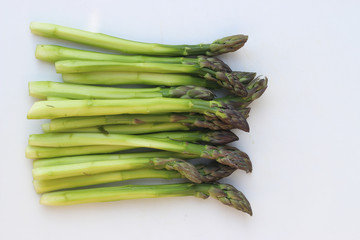 Green asparagus on white background