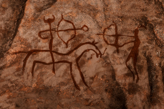 iDrawing of ancient hunters on the wall of the cave. history of antiquities, archaeology.