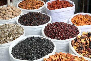 Oriental Bazaar , dried fruits and seeds .dried fruits , nuts and seeds are sold in bags.