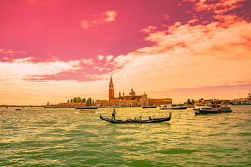 Bloody reddish sunset in amazing Venetian Grand Channel, Venice, Italy