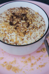 Banana smoothie bowl with peanut butter and dark chocolate pieces