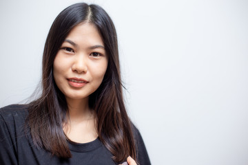 Fototapeta premium Joyful asian beautiful women smiling on white background