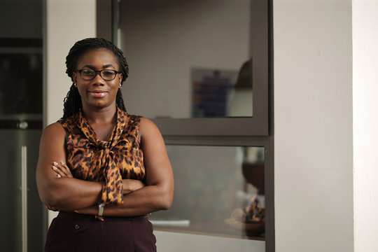 portrait of a woman in front of window