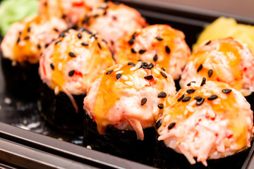 Fresh sushi and rolls fast food in a box close up