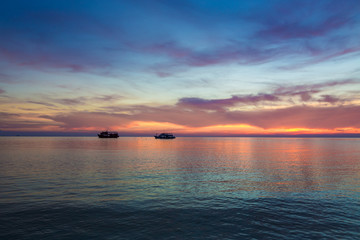 Silhouette sunset at beautiful beach with colorful sky cloud