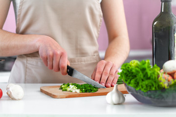 Chopped vegetables for fresh salad on chopping board for dinner close up. Clean healthy food and proper nutrition. Diet