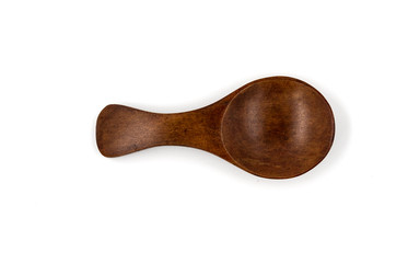 Empty wooden spoons isolated on white background, close up