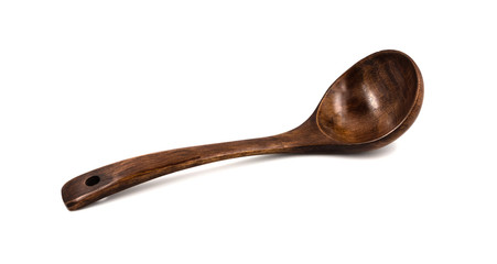 Empty wooden spoons isolated on white background, close up