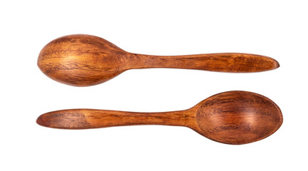 Empty wooden spoons isolated on white background, close up
