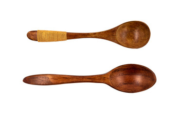 Empty wooden spoons isolated on white background, close up