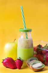 kiwi and apple smoothies on a yellow background