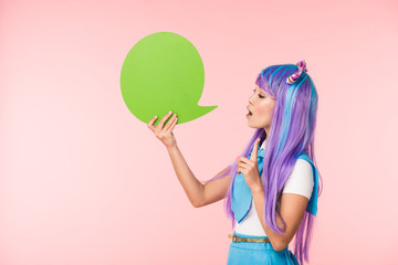 Asian anime girl holding green speech bubble and showing idea sign on pink