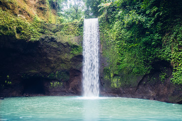 Fototapeta na wymiar Tibumana waterfall at Bali, Indonesia