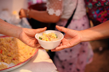 The Society of Sharing Food to Homeless and the Poorest: The Concept of Feeding : The hands of the rich give food to the hands of the poor