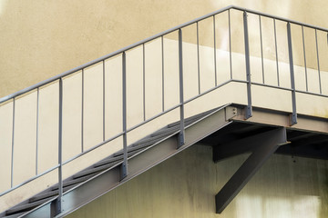 gray metal ladder on the wall of a building