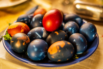 Traditional easter eggs on a plate isolated with a blurred background