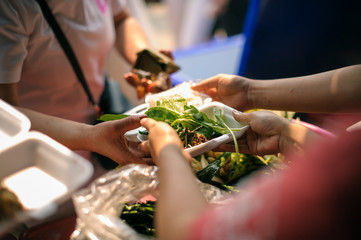 Charity food is the hope of the poor who have no money: concept of begging food : Volunteers Share Food to the Poor to Relieve Hunger