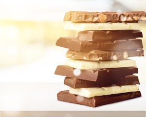 Delicious chocolates isolated on background