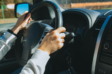 woman hands on steering wheel. car travel concept