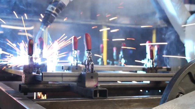 Close Up Of Metal And Iron Welding Robot.