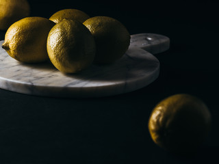 Fresh lemon on black background