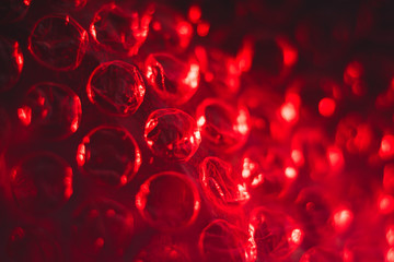 texture red cellophane with air bubbles, abstract, macro
