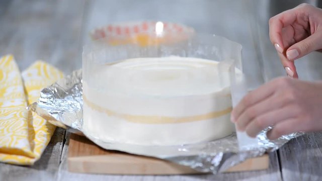 Peach mousse cake with acetate sheet.
