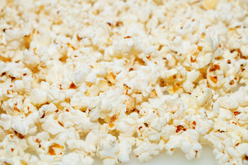 Fresh hot popcorn scattered on the table