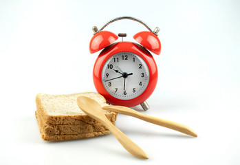Red alarm clock with toast bread