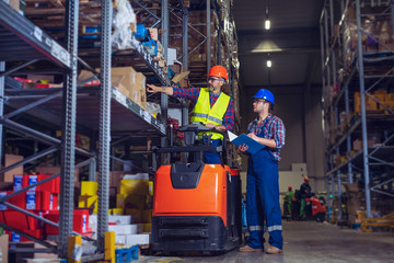 Manual Workers Working In Warehouse