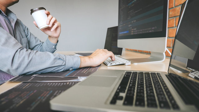 Professional Developer programmer working a software website design and coding technology, writing codes and database in company office, Global cyber connection technology
