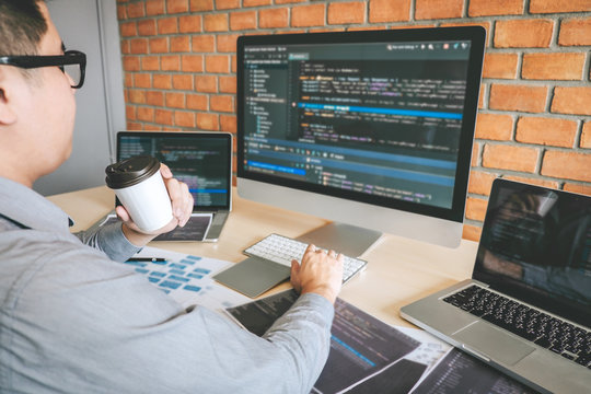 Professional Developer programmer working a software website design and coding technology, writing codes and database in company office, Global cyber connection technology