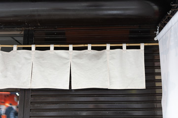 The curtain-like fabric that hangs in front of traditional Japanese restaurants and shops not only serves as a signboard, but holds a larger meaning,