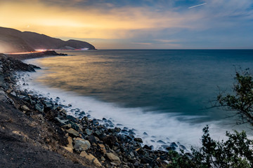 sunset on coast of sea