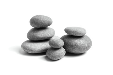 Fototapeta na wymiar Stacked pebbles isolated on white background. Group of smooth grey stones. Sea pebble