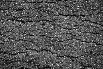 crack and texture of asphalt road - top view background.