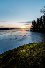 Sunrise by icy lake