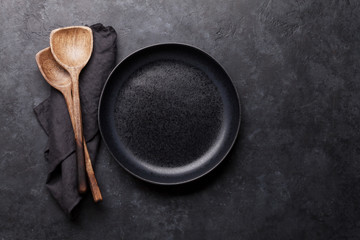 Cooking wooden utensils and empty plate